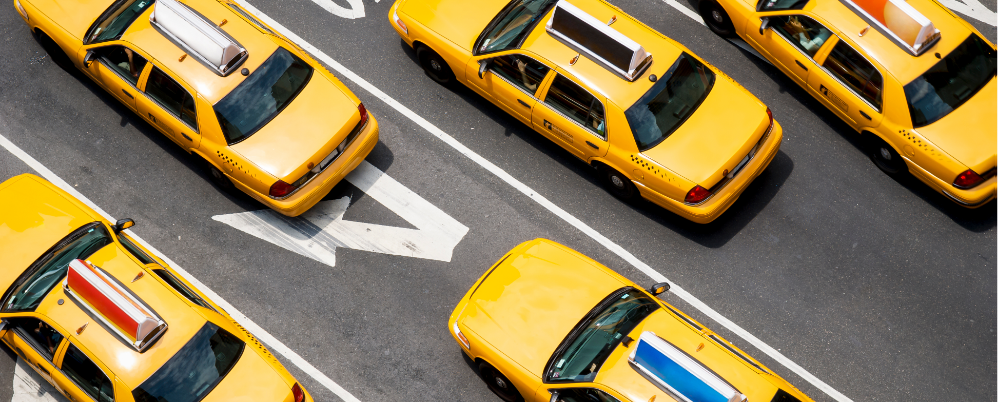 Image of taxi driver using phone